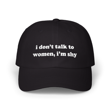 Black dad hat with "i don't talk to women, i'm shy" embroidered in white on the front panel