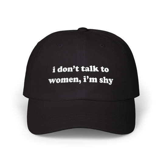 Black dad hat with "i don't talk to women, i'm shy" embroidered in white on the front panel