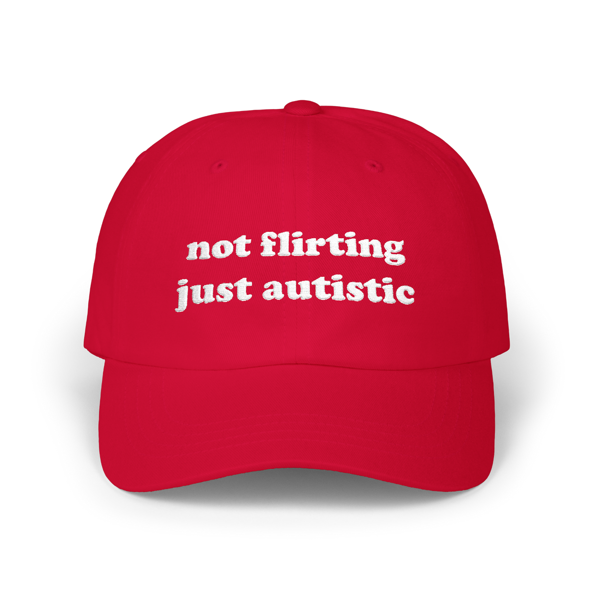 Cranberry dad hat with "not flirting just autistic" embroidered in white on the front panel