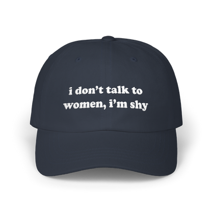 Navy dad hat with "i don't talk to women, i'm shy" embroidered in white on the front panel