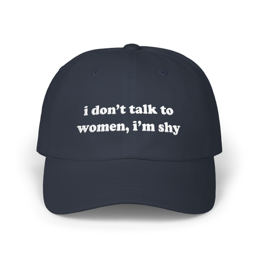 Navy dad hat with "i don't talk to women, i'm shy" embroidered in white on the front panel